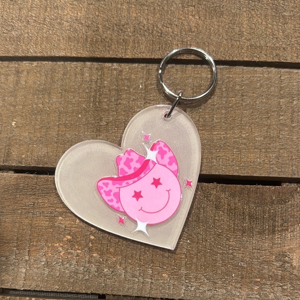 Heart-Shaped Keychain with Pink Smiley Design